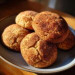 Close-up of a pile of freshly baked Cinnamon Sugar Christmas Cookies dusted with cinnamon and sugar.