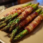 Close-up of delicious Prosciutto-Wrapped Asparagus Spears, cooked to perfection with crispy bacon.