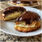 Close-up of a slice of the Best Boston Cream Pie Cookie Dessert with chocolate ganache.