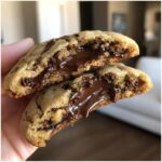 Close-up of a Nutella-Stuffed Cookie cut in half, revealing a gooey Nutella center.