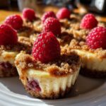 Close-up of delicious Raspberry Cheesecake Bites topped with fresh raspberries.
