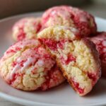 Close-up of STRAWBERRY CAKE MIX COOKIES, showing texture and glaze, on a white plate.
