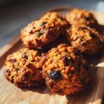 Close-up of freshly baked Blueberry Honey Pup Crisps on a wooden tray, perfect for your furry friend.