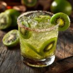 Close-up of a Green Margarita with Kiwi, garnished with kiwi slices and a sugared rim.