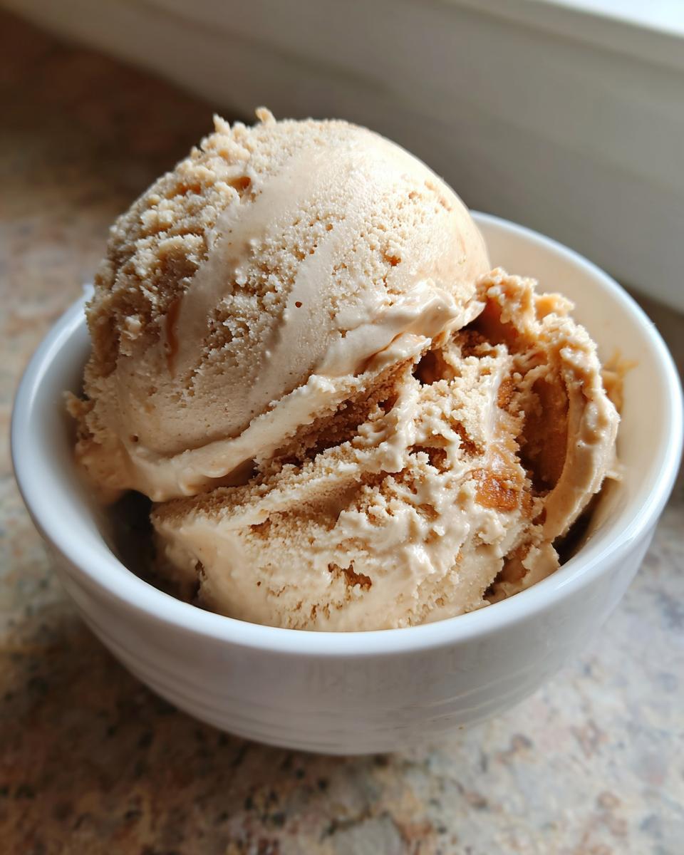 Close-up of a bowl of Peanut Butter Banana Frozen Yogurt, creamy and delicious.