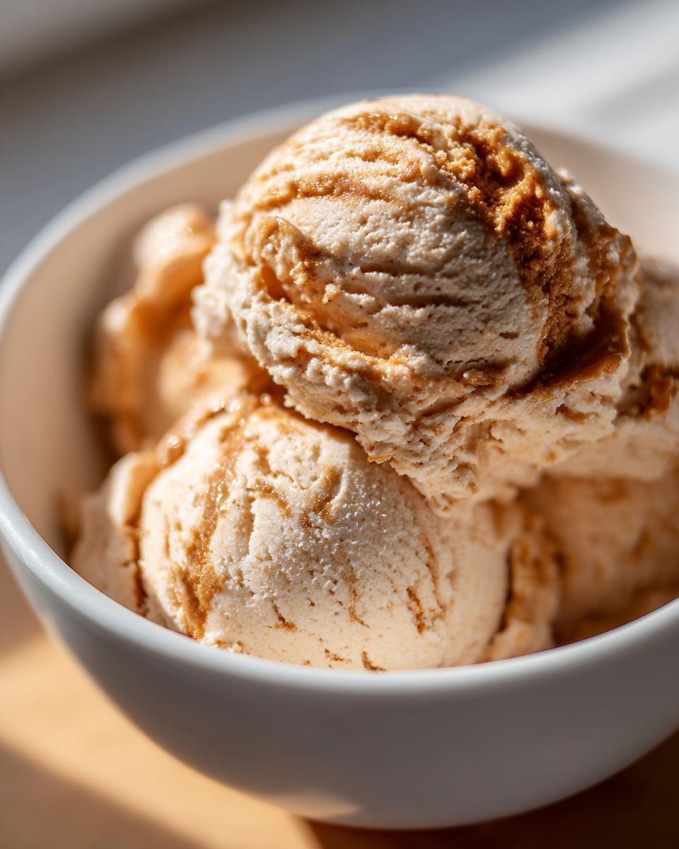 Close-up of Peanut Butter Banana Frozen Yogurt Treats in a white bowl, showing creamy texture.