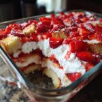 Close-up of a layered Strawberry Shortcake Trifle with strawberries, whipped cream, and cake.