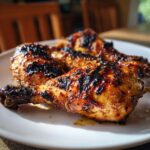 Close-up of delicious Grilled Honey Mustard Chicken Drumsticks on a white plate, ready to eat.