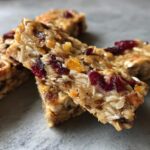Close-up of delicious Banana Oat No-Bake Dog Bars with oats, dried cranberries, and nuts.