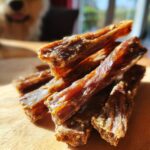 Close-up of a pile of homemade Beef and Flaxseed Healthy Dog Chews, a healthy treat for dogs.