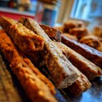 Close-up of various Beef and Oatmeal Long-Lasting Treat Sticks, showing texture and detail.