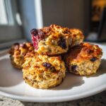 Pile of homemade Blueberry Peanut Butter Dog Treats on a white plate, ready to be enjoyed.