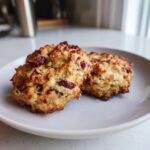 Two delicious Cranberry Oat Holiday Dog Treats on a plate, perfect for your furry friend.