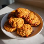 Pile of delicious 4-ingredient homemade dog treats on a white plate.