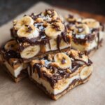 Close-up of Peanut Butter Banana Frozen Yogurt Bark for Dogs, topped with bananas and nuts.