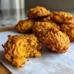 Close-up of freshly baked Pumpkin Sweet Potato Dog Biscuits, a healthy treat for dogs.