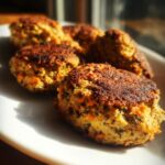 Close-up of several Tuna & Rice Dog Patties on a white plate, perfect for your pup.