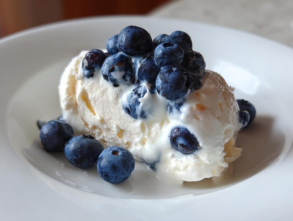 Close-up of a Yogurt Blueberry Frozen Dog Drops topped with fresh blueberries, a refreshing treat.